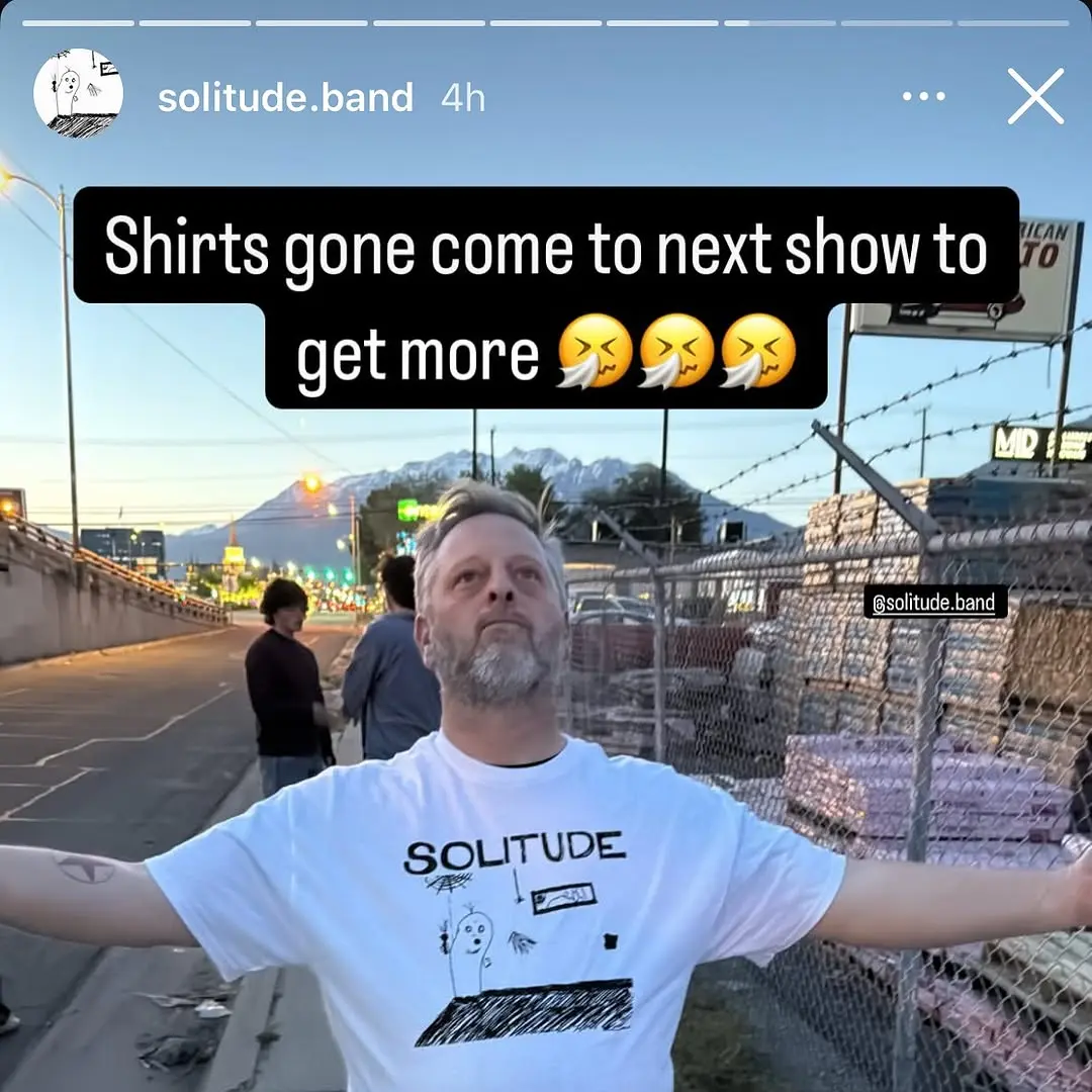 Solitude band shirt worn outdoors